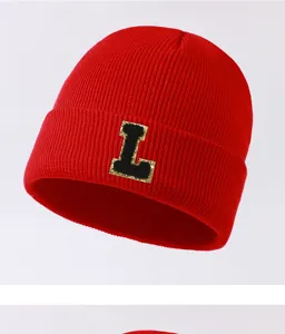 Red knit beanie hat with letter L patch, warm winter hat for men and women outdoor wear.
