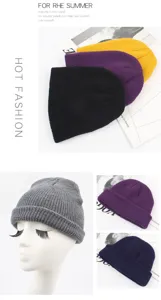 Close-up detail view of solid color knitted beanie hats in multiple vibrant colors for winter.