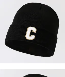 Black knit beanie hat for men and women, stylish letter C patch winter warm cap street style.