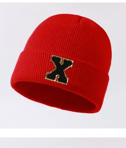 Red knit beanie hat for men and women, autumn winter warm cuff cap with stylish letter X patch.