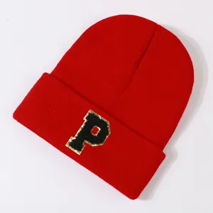 Red knit beanie hat for men and women, stylish winter warm cap with letter P patch.