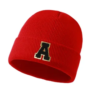 Red knit beanie winter warm hat with letter patch, stylish casual outdoor cold weather cap.