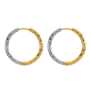 Detailed close-up of two-tone stainless steel hoop earrings with hammered metal texture