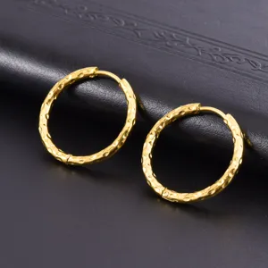 Detailed macro shot showing the unique hammered texture on gold plated hoop earrings.