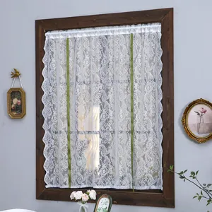 Detailed view of white lace short curtain with green ribbons, retro French style door curtain.