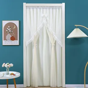 Detailed view of white double layer lace door curtain with bow tie, elegant home partition decor.