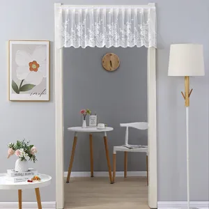 White lace door curtain valance showcased in cozy home interior setting, perfect for room decor.