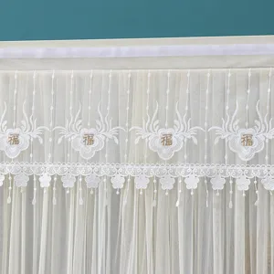 Exquisite lace door curtain with floral embroidery and mesh fabric, elegant home decor detail.