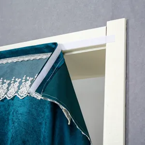 Velvet door curtain close up detail showing white lace trim and easy mount velcro installation.