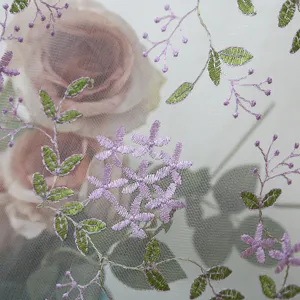 Detail view of purple floral embroidered lace sheer curtain, elegant fabric for bedroom decor.