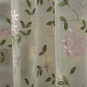 Close-up detail of French vintage embroidered sheer curtain, showing exquisite floral mesh texture.