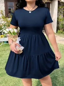 Detail view of the casual solid color short sleeve tiered dress, comfortable fabric, ruffle hem.