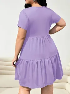 Detail view of plus size solid purple short sleeve tiered t-shirt dress, casual style.