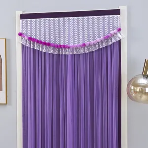 Detail view of purple door curtain with lace valance and pom-pom fringe, elegant home decor.