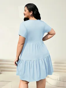 Detailed view of plus size light blue tiered dress back design, comfortable short sleeve casual wear.