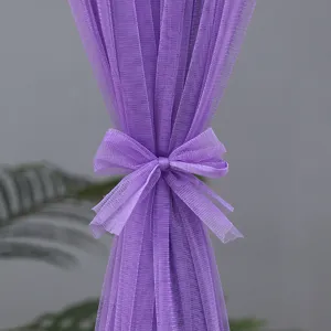 Close-up detail of purple sheer curtain with cute bow tie design, lightweight texture for room partition.
