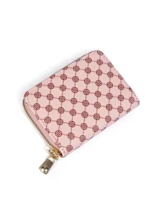 Pink clover print wallet detail view showcasing the textured leather and golden zipper.