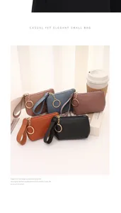 Mini litchi pattern coin purse with wrist strap and zipper, fashionable daily wallet.