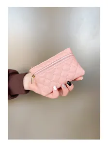 Pink quilted PU leather coin purse detail shot, double zipper wallet showcasing texture.