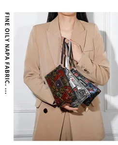 Detailed view of embossed floral leather clutch purse showcasing fine craftsmanship and colors.