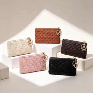 Women's woven mini coin purse with keychain, stylish small wallet and storage bag.