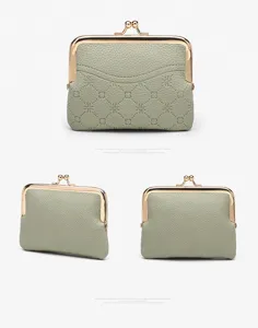 Green vintage kiss-lock coin purse with metal frame and debossed clover pattern, compact card holder