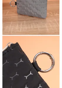 Waterproof coin purse detail view, portable wallet with key ring and bone pattern design.