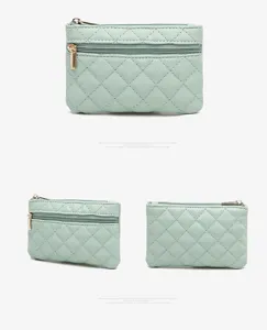 Mint green quilted PU leather coin purse with double zippers, compact card and key holder wallet.