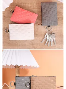Detailed view of portable waterproof quilted coin purse and key pouch with zipper closure.