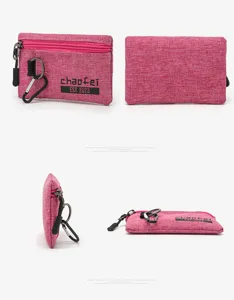 Detailed view of the pink oxford fabric coin pouch with zipper, keyring and carabiner.