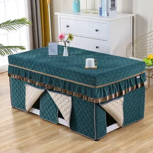 Winter thickened rectangular heating table cover, dark green quilted fabric with ruffled trim.