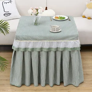 Green and white checkered square table cover with ruffled daisy lace hem for home decor.