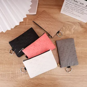 Waterproof quilted coin purse and key pouch with keyring, portable small wallet for daily use.