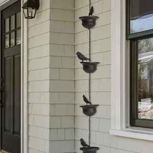 Detailed view of mobile birds on cups rain chain for decorative outdoor water drainage