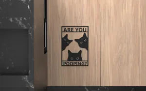 Funny black cat bathroom wall decor sign with 'Are you pooping?' text on wooden door