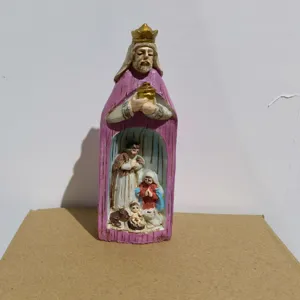 Detailed macro view of a resin nativity scene figurine with Wise Man cloak design