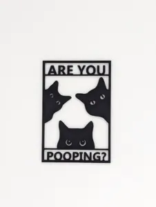 Detailed view of a creative black cat bathroom wall sign with text 'Are You Pooping?'