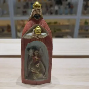 Detailed view of resin Three Wise Men King figurine with a carved nativity scene inside