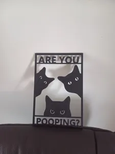 Black cat bathroom wall sign featuring playful 'Are you pooping?' cut-out design