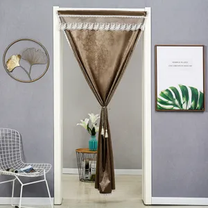 Brown velvet doorway curtain detail view, featuring elegant white lace trim and tassels.