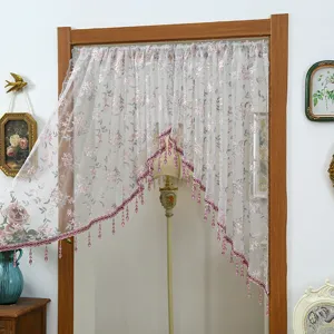 Lace door curtain with pink floral pattern and beaded fringe for bedroom decoration and privacy.