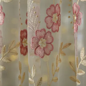 Detailed view of French vintage floral sheer curtain with delicate pink and gold embroidery lace.