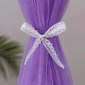 Purple lace mesh curtain with a white bow tie, elegant decorative partition net for home.