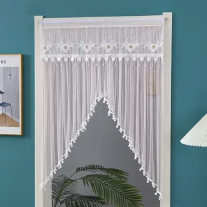 White lace door curtain with delicate embroidery Fu character and pompom fringe for bedroom privacy.