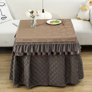 Detail of waterproof thickened electric table cover with fleece lining and ruffles for winter.