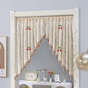 Detailed view of French vintage lace door curtain with cherry decor and elegant tassels.