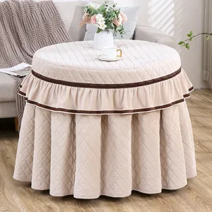 Verdikte, gewatteerde ronde tafelken voor thuis, elegante beige hoes voor verwarmingstafel.