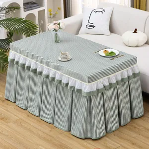 Green checkered table cover with white lace skirt design, perfect for home coffee tables and desks.