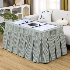 Detail view of green checkered heating table cover fabric texture in a cozy living room setting.