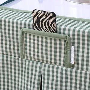 Detail shot of green and white checkered table cover pocket and soft flannel fabric texture.